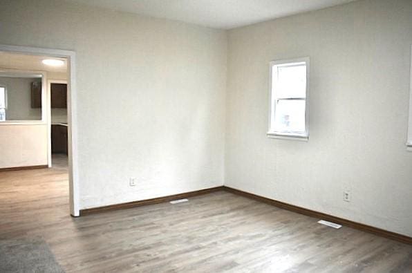 empty room featuring wood-type flooring