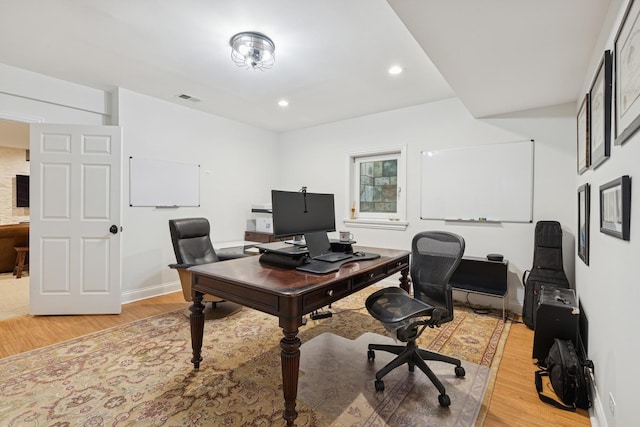 office area featuring recessed lighting, visible vents, light wood-style flooring, and baseboards