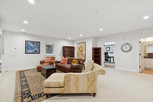 living area featuring recessed lighting, light colored carpet, and baseboards