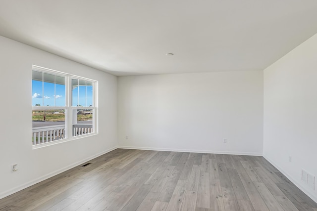 unfurnished room featuring light wood-type flooring