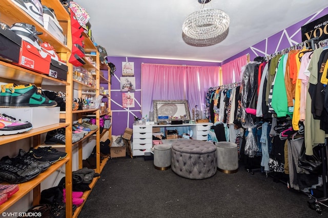 walk in closet with carpet floors