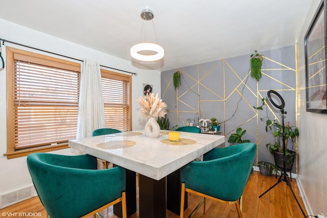 dining area with light wood-type flooring