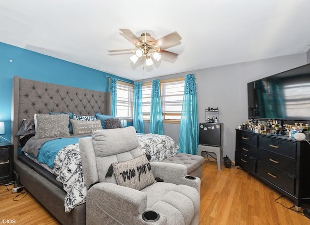 bedroom featuring ceiling fan and light hardwood / wood-style floors