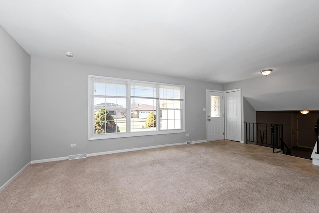 unfurnished living room with carpet floors