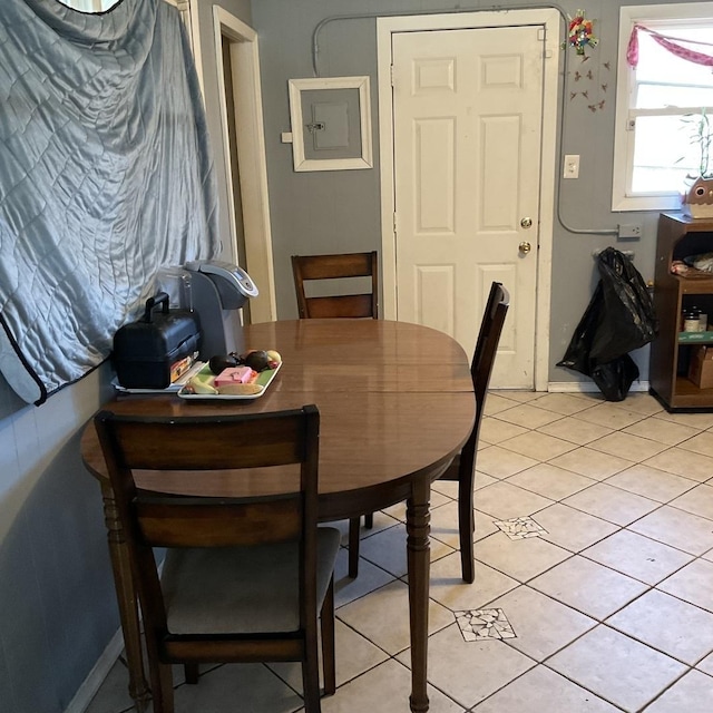 dining area featuring light tile patterned flooring