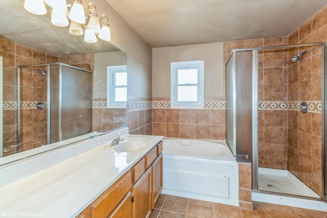 bathroom featuring tile patterned flooring, vanity, and independent shower and bath