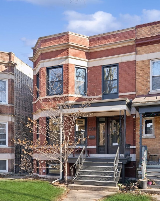 townhome / multi-family property with covered porch