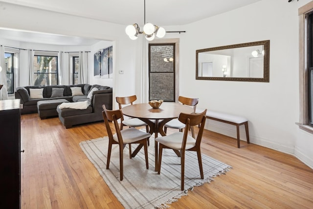 dining room featuring a chandelier and light hardwood / wood-style flooring