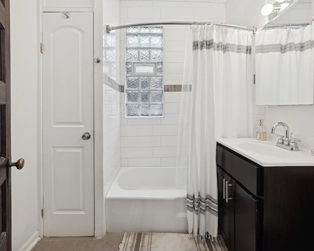 bathroom featuring vanity and shower / bath combination with curtain