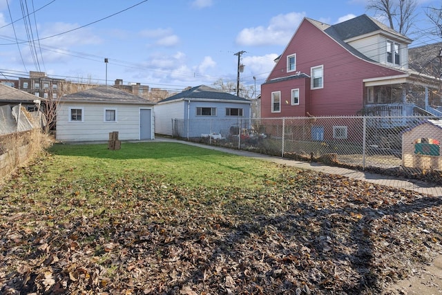 rear view of house with a lawn