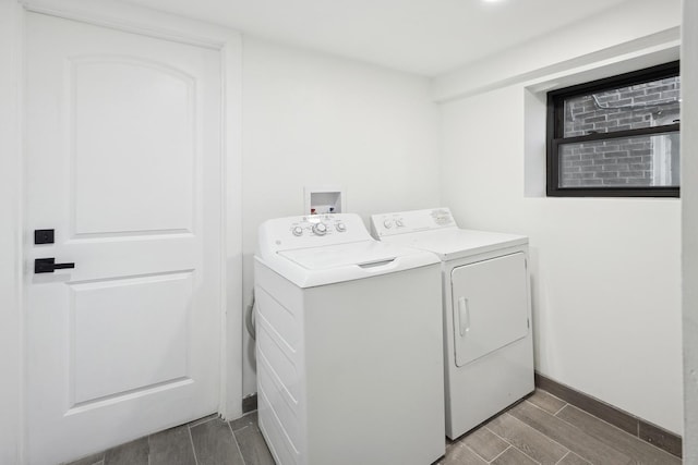 clothes washing area with washer and clothes dryer