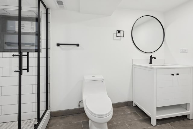 bathroom featuring vanity, toilet, and walk in shower