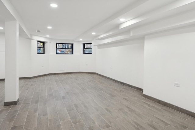 basement with light hardwood / wood-style floors