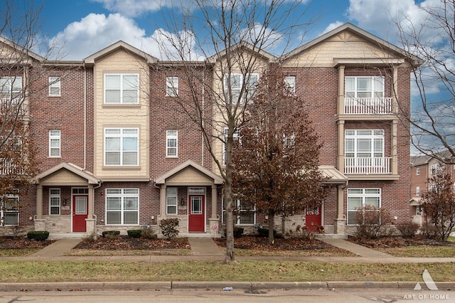 multi unit property featuring a balcony