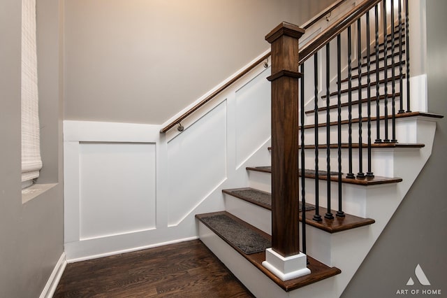 staircase with hardwood / wood-style floors