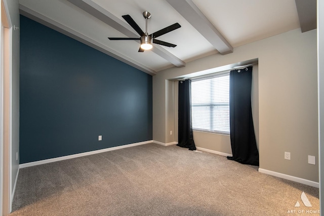 empty room with lofted ceiling with beams, ceiling fan, and light colored carpet