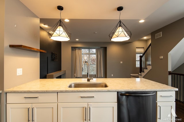 kitchen with dishwasher, decorative light fixtures, white cabinets, and sink