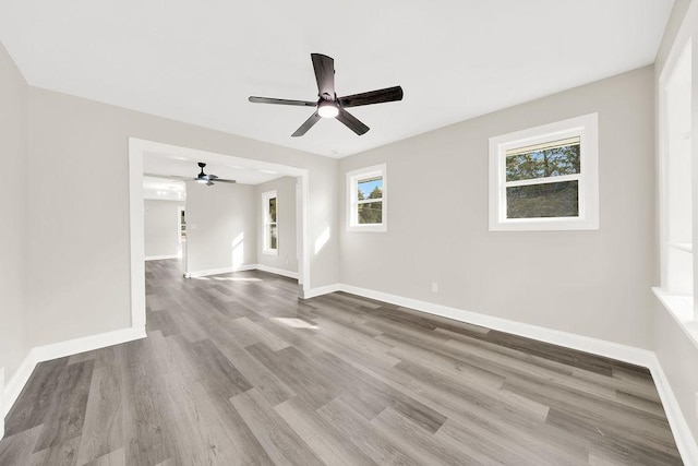 spare room with wood-type flooring and ceiling fan