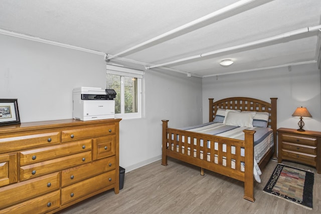 bedroom with light wood-type flooring