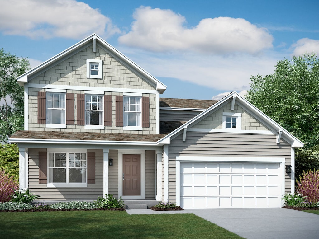 view of front of house featuring a front yard and a garage