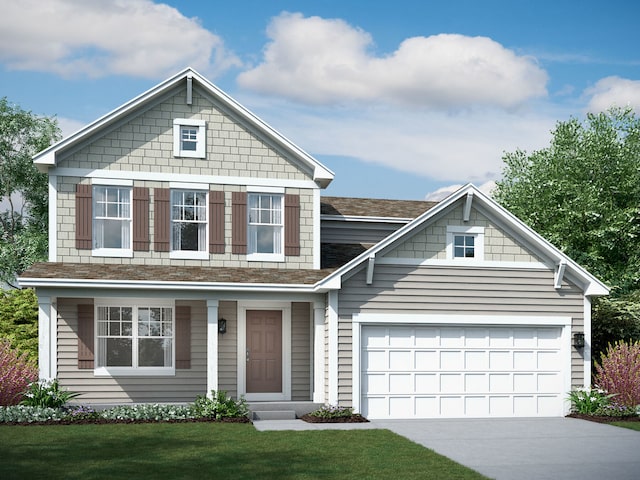 view of front of house featuring a front yard and a garage