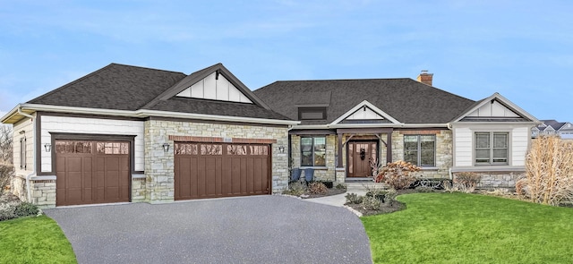 view of front facade with a garage and a front lawn