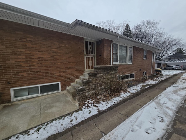 view of front of home with brick siding