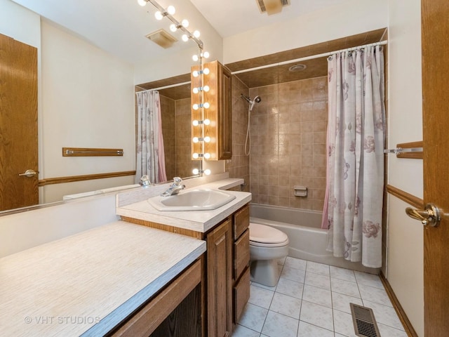 full bathroom featuring toilet, vanity, tile patterned flooring, and shower / tub combo with curtain