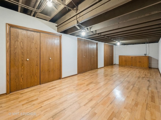 basement featuring wood-type flooring