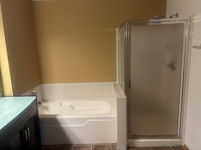 bathroom with separate shower and tub, vanity, and tile patterned flooring