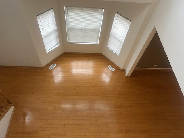 unfurnished room with light hardwood / wood-style floors