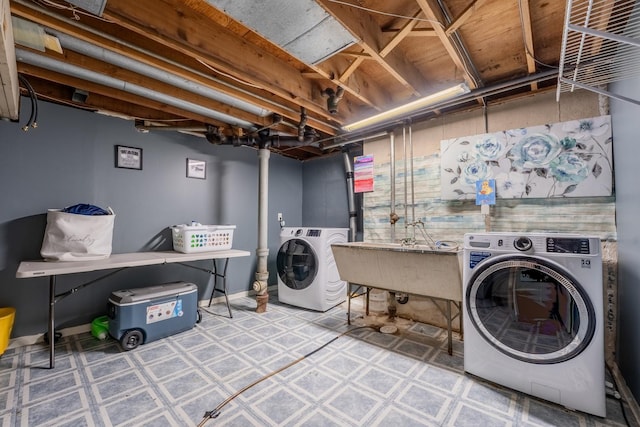 washroom featuring sink and washing machine and clothes dryer