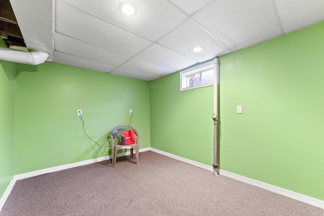 playroom featuring carpet flooring and a drop ceiling