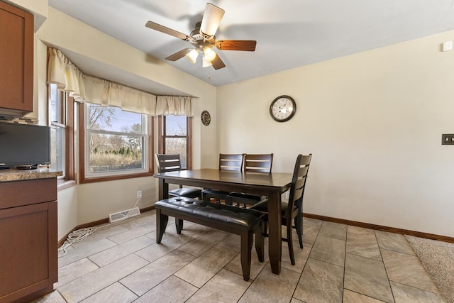 dining area featuring ceiling fan