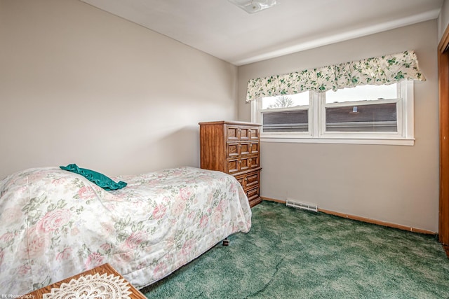 bedroom featuring dark colored carpet