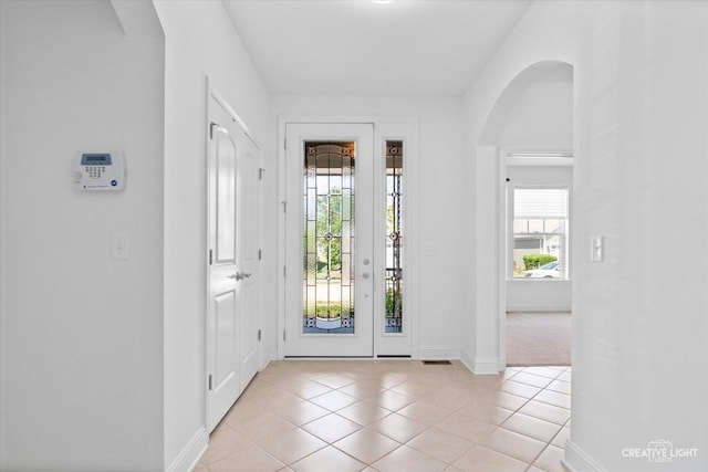 foyer entrance featuring light tile patterned floors