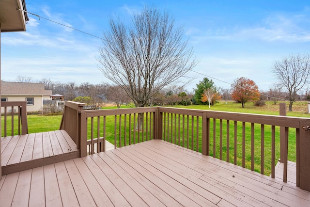 wooden terrace with a yard