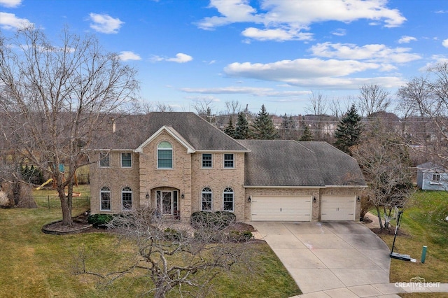 view of front of property featuring a front yard and a garage