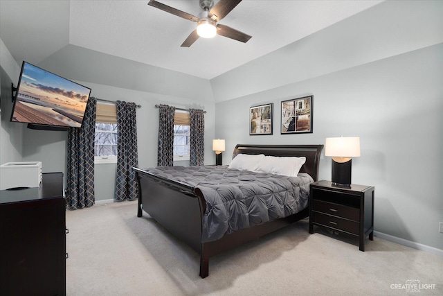 carpeted bedroom featuring ceiling fan and vaulted ceiling