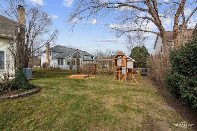 view of yard with cooling unit and a playground