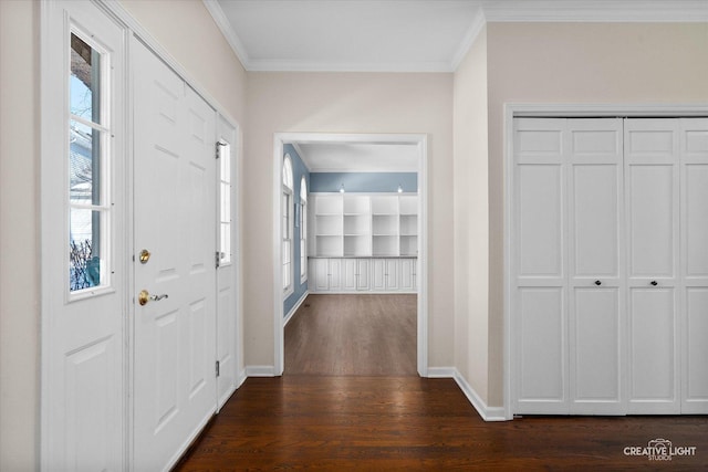 foyer with dark hardwood / wood-style flooring and crown molding