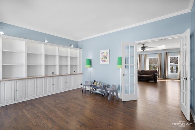 sitting room with french doors, dark hardwood / wood-style flooring, and ornamental molding