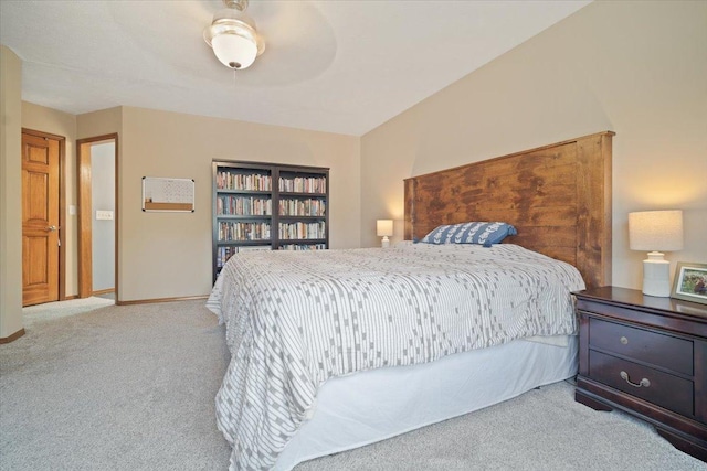 bedroom featuring ceiling fan and light carpet