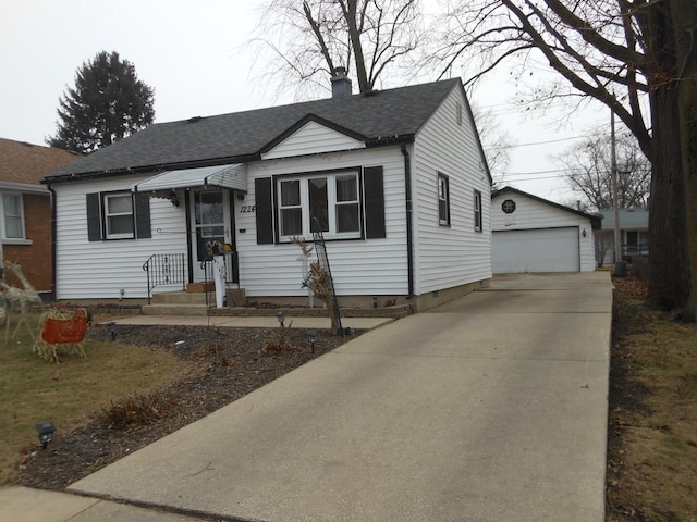 view of front facade featuring an outbuilding and a garage