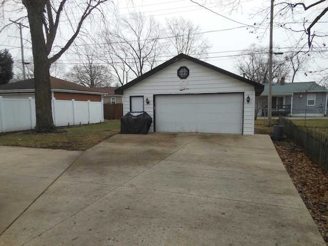 view of property exterior with a garage and an outbuilding