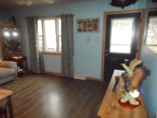 living room with dark wood-type flooring