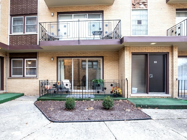 entrance to property with a balcony