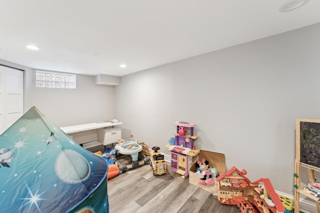 playroom with light wood-type flooring