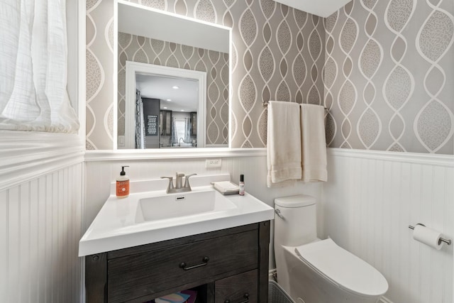 bathroom with vanity and toilet