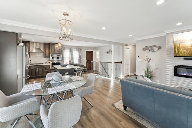 dining area featuring crown molding and wood-type flooring